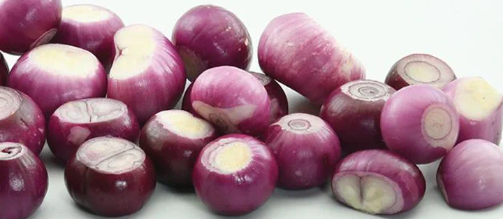 Fresh red onions showing layers and quercetin-rich color